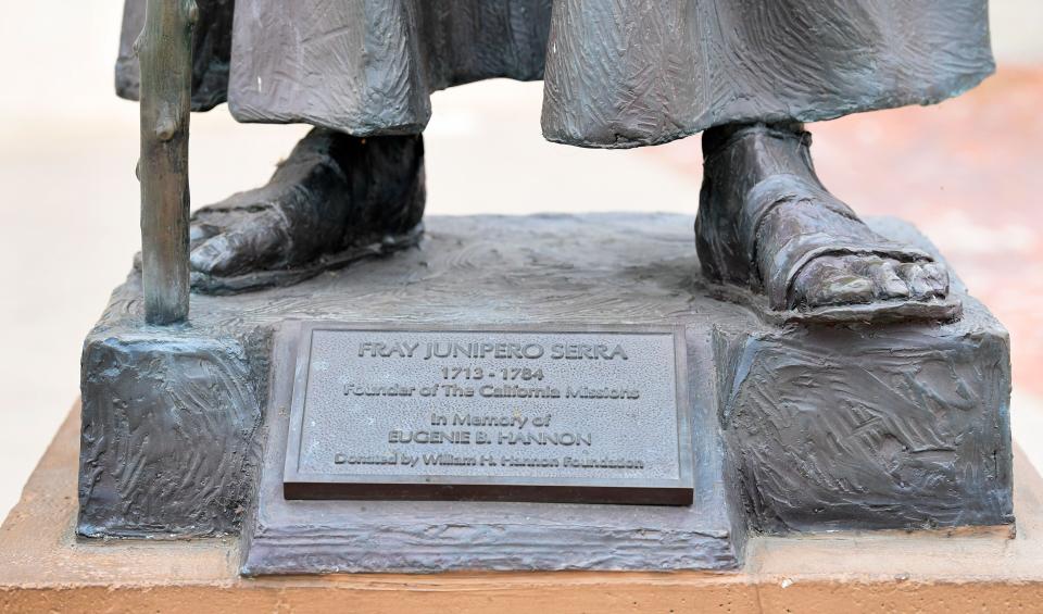 A statue of Junipero Serra in front of the San Gabriel Mission. (Photo: FREDERIC J. BROWN via Getty Images)