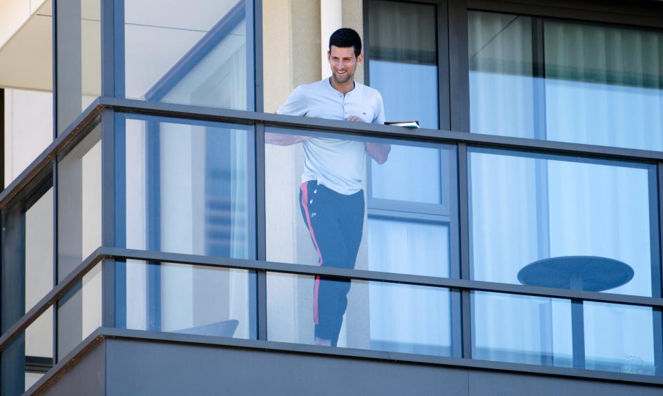 Serbia's Novak Djokovic stands on a balcony n Adelaide, Australia on Jan. 19.
