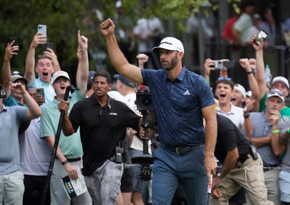 Dustin Johnson celebrates after sinking a putt to win the tournament on the first playoff hole on the 18th in the LIV Golf Invitational-Boston tournament on Sept. 4 in Bolton.