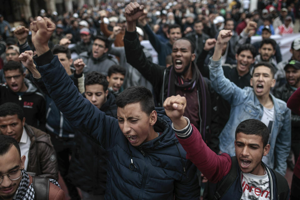 Moroccans gesture and chant slogans as they take part in a demonstration in Rabat, Morocco, Sunday, April 21, 2019. Protesters are condemning prison terms for the leader of the Hirak Rif protest movement against poverty and dozens of other activists. (AP Photo/Mosa'ab Elshamy)