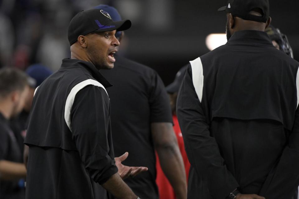 East coach D'Anton Lynn, of the Baltimore Ravens, talks on the sideline during the East-West Shrine Bowl