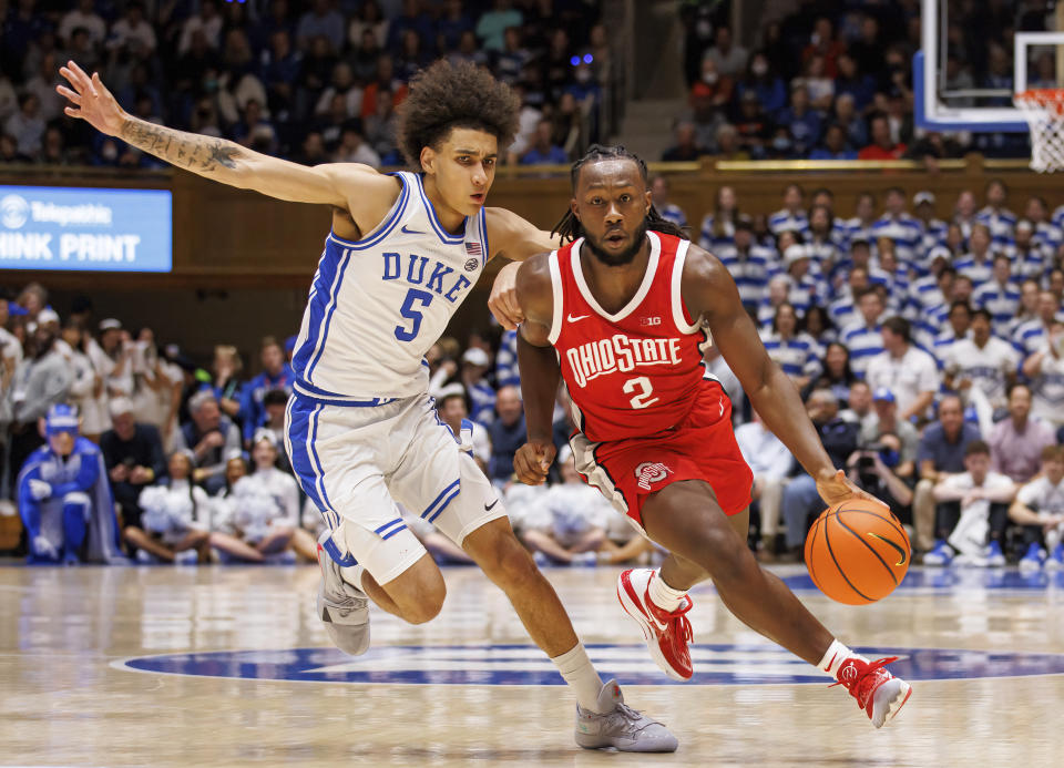 Ohio State's Bruce Thornton (2) handles the ball as Duke's Tyrese Proctor (5) defends during the first half of an NCAA college basketball game in Durham, N.C., Wednesday, Nov. 30, 2022. (AP Photo/Ben McKeown)