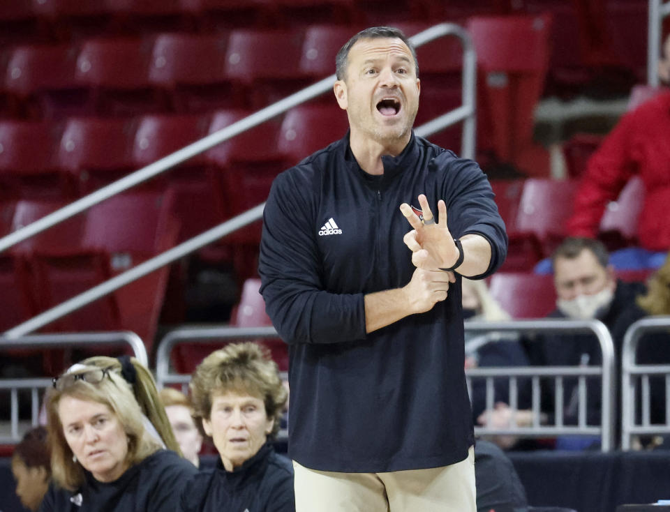 Louisville head coach Jeff Walz calls to his team during the first half of an NCAA college basketball game against Boston College, Sunday, Jan. 16, 2022, in Boston. (AP Photo/Mary Schwalm)