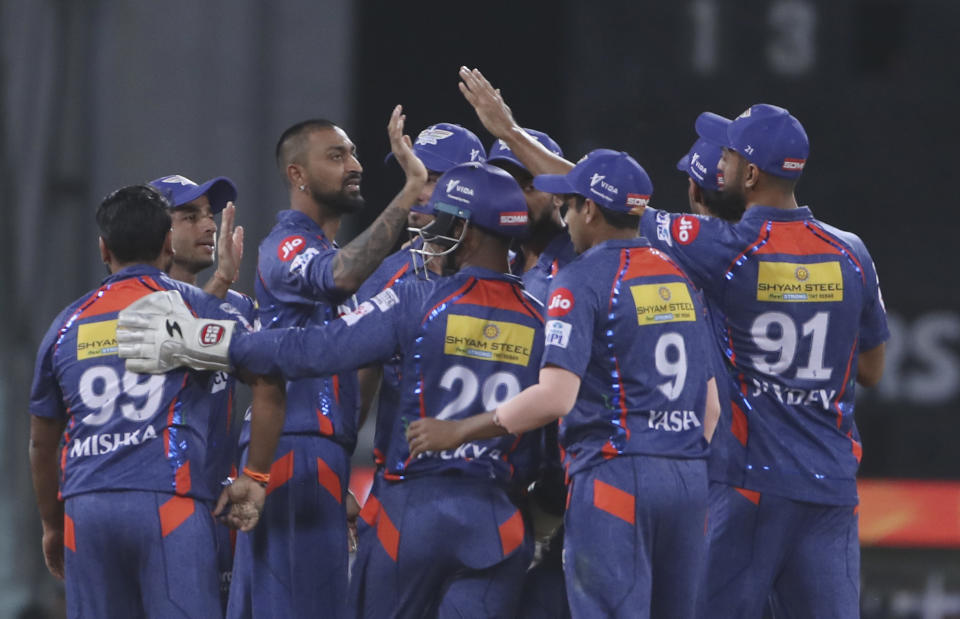 Lucknow Super Giants players celebrate the wicket of Mayank Agarwal of Sunrisers Hyderabad during the Indian Premier League cricket match between Lucknow Super Giants and Sunrisers Hyderabad, in Lucknow, India, Friday, April 7, 2023. (AP Photo/Surjeet Yadav)