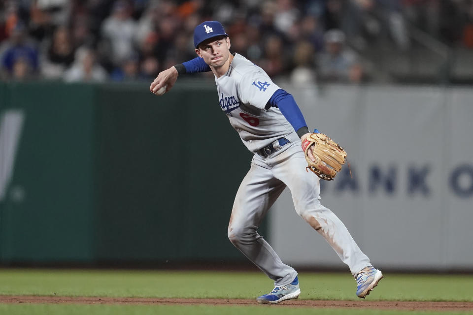 Los Angeles Dodgers shortstop Trea Turner throws out San Francisco Giants' Heliot Ramos at first base during the fifth inning of a baseball game in San Francisco, Saturday, Sept. 17, 2022. (AP Photo/Jeff Chiu)