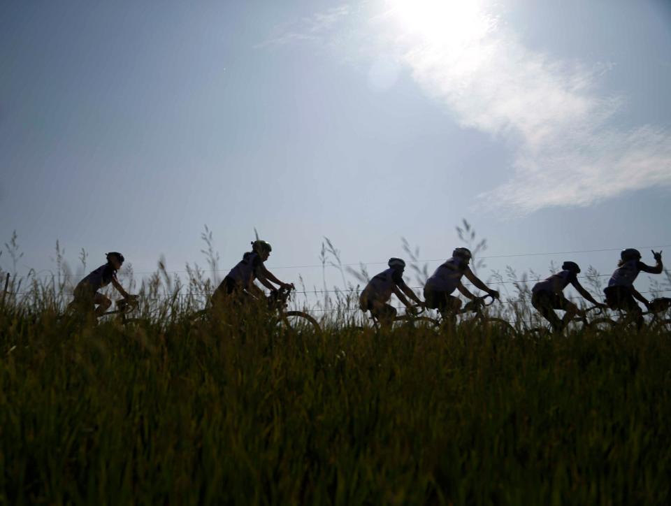 Cyclists roll out of West Liberty during the RAGBRAI route inspection pre-ride along the day 7 route on Saturday, June 10, 2023.