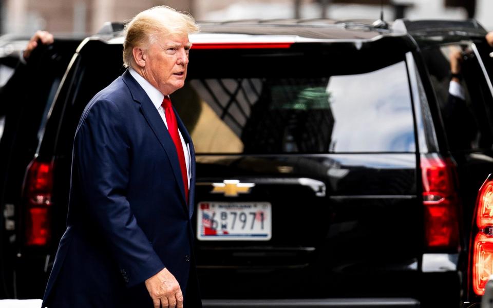 The former US president leaving Trump Tower on Wednesday morning - AP Photo/Julia Nikhinson