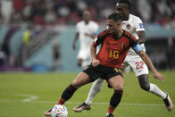 Belgium's Eden Hazard, left, challenges for the ball with Canada's Richie Laryea during the World Cup group F soccer match between Belgium and Canada, at the Ahmad Bin Ali Stadium in Doha, Qatar, Wednesday, Nov. 23, 2022. (AP Photo/Hassan Ammar)