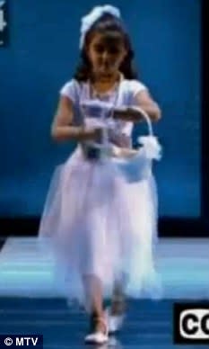 6-year-old Lourdes plays flower girl in her mom's 2003 performance of Like a Virgin with Britney Spears and Christina Aguilera on MTV