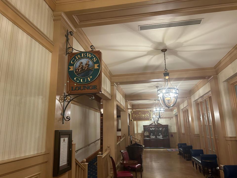 Disney's Crew Cup sign inside building