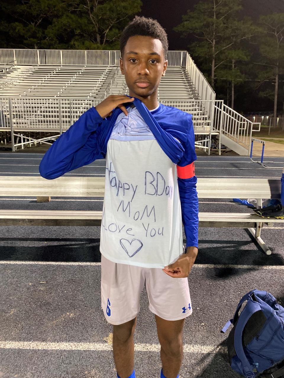 Booker T. Washington senior captain Fatobi White displays a birthday message written for his mother after helping the Wildcats capture a 4-1 win during the Region 1-5A quarterfinal against Menendez on Feb. 8, 2023 from Sherman L. Robinson Stadium. White scored a goal in the first half.