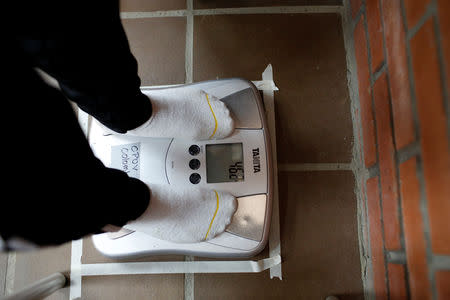 A child gets her weight measured during a health program of the NGO "Comparte por una vida" (Share for a life) at La Frontera school in Cucuta, Colombia February 5, 2019. Picture taken February 5, 2019. REUTERS/Marco Bello