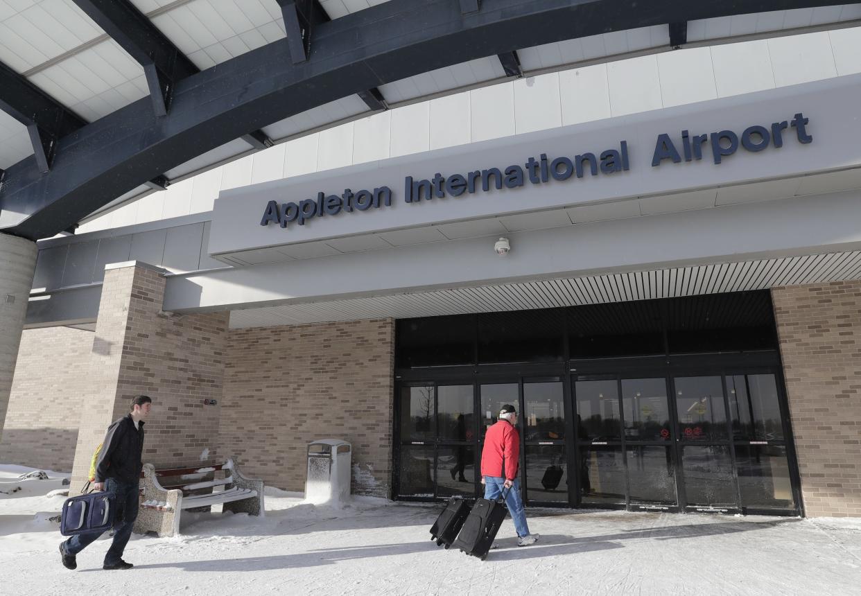 Cody Dorner, left, of Green Bay and his father Sam Dorner of Luxemberg enter the Appleton International Airport on Jan. 30, 2019, in Greenville, Wis.