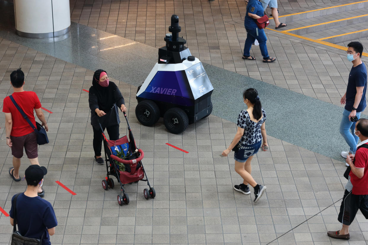 An HTX (Home Team Science and Technology Agency) ground robot, named Xavier patrols a neighbourhood mall to support public officers in enhancing public health and safety on 8 September 2021 in Singapore. (Photo by Suhaimi Abdullah/NurPhoto via Getty Images)