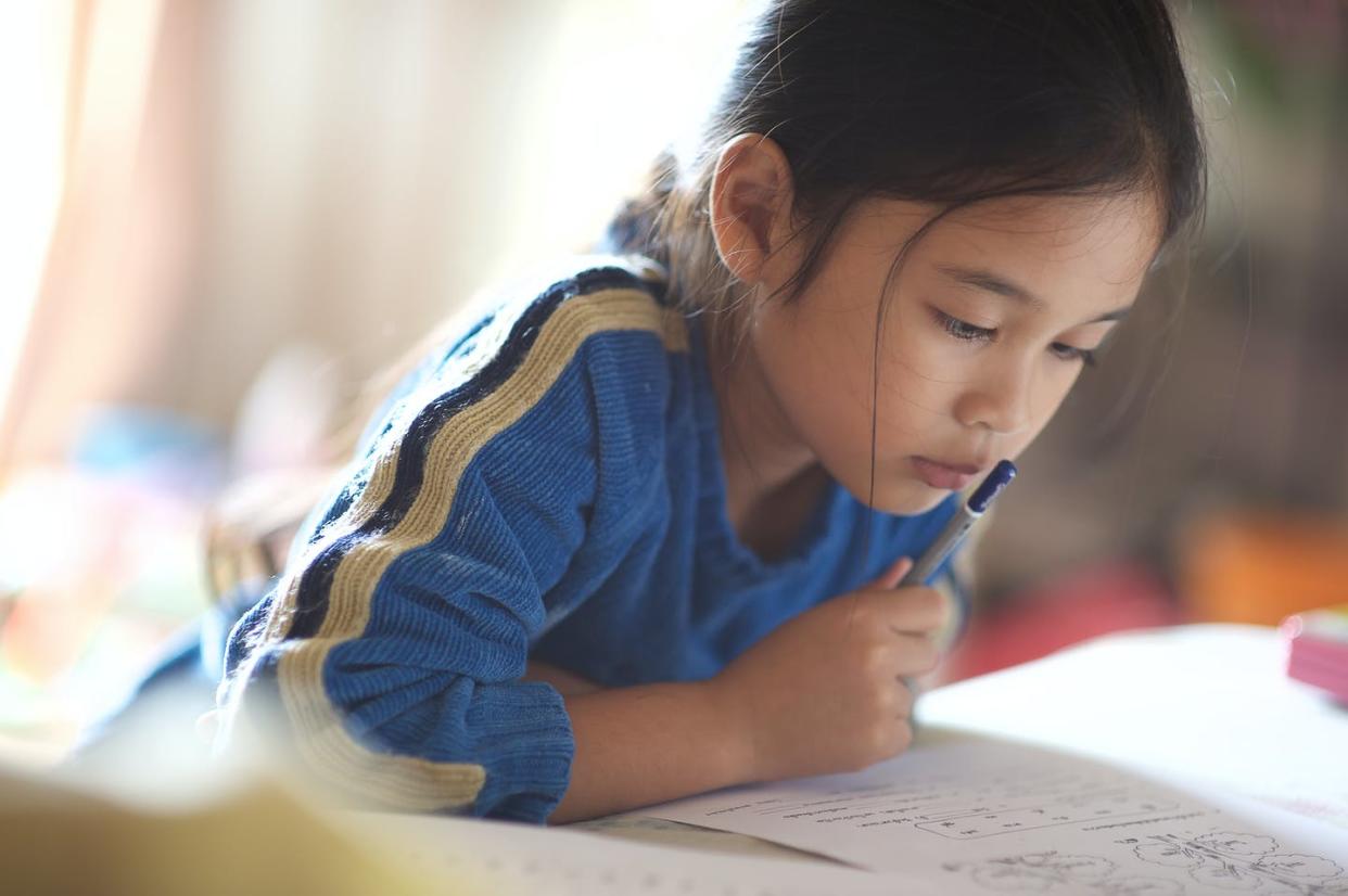 <span class="caption">Those worksheets might not do much for a child's grades.</span> <span class="attribution"><a class="link " href="https://www.shutterstock.com/image-photo/asian-young-girl-read-book-300226694?studio=1" rel="nofollow noopener" target="_blank" data-ylk="slk:mirtmirt/Shutterstock.com;elm:context_link;itc:0;sec:content-canvas">mirtmirt/Shutterstock.com</a></span>