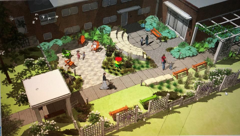 This rendering shows how the proposed Wood Library outdoor reading garden might look.