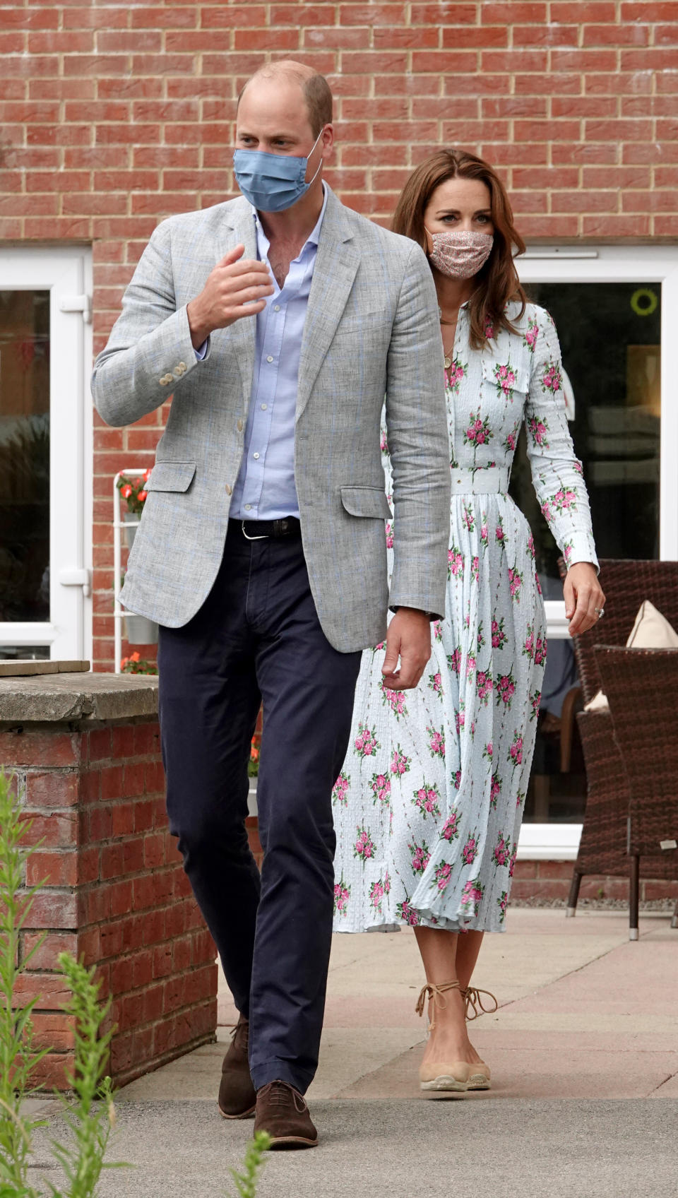 CARDIFF, WALES - AUGUST 05: Prince William, Duke of Cambridge and Catherine, Duchess of Cambridge visit the Shire Hall Care Home, where they spoke to some of the home's staff, residents and their family members on August 5, 2020 in Cardiff, Wales. In May, The Duke and Duchess joined staff and residents from Shire Hall via video call, and took their turn as guest bingo callers for a game in the home's cinema. (Photo by Jonathan Buckmaster - WPA Pool/Getty Images)