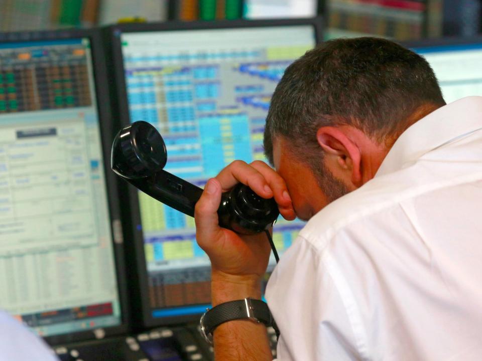 A trader from BGC, a global brokerage company in London's Canary Wharf financial centre reacts during trading June 24, 2016 after Britain voted to leave the European Union in the EU BREXIT referendum.