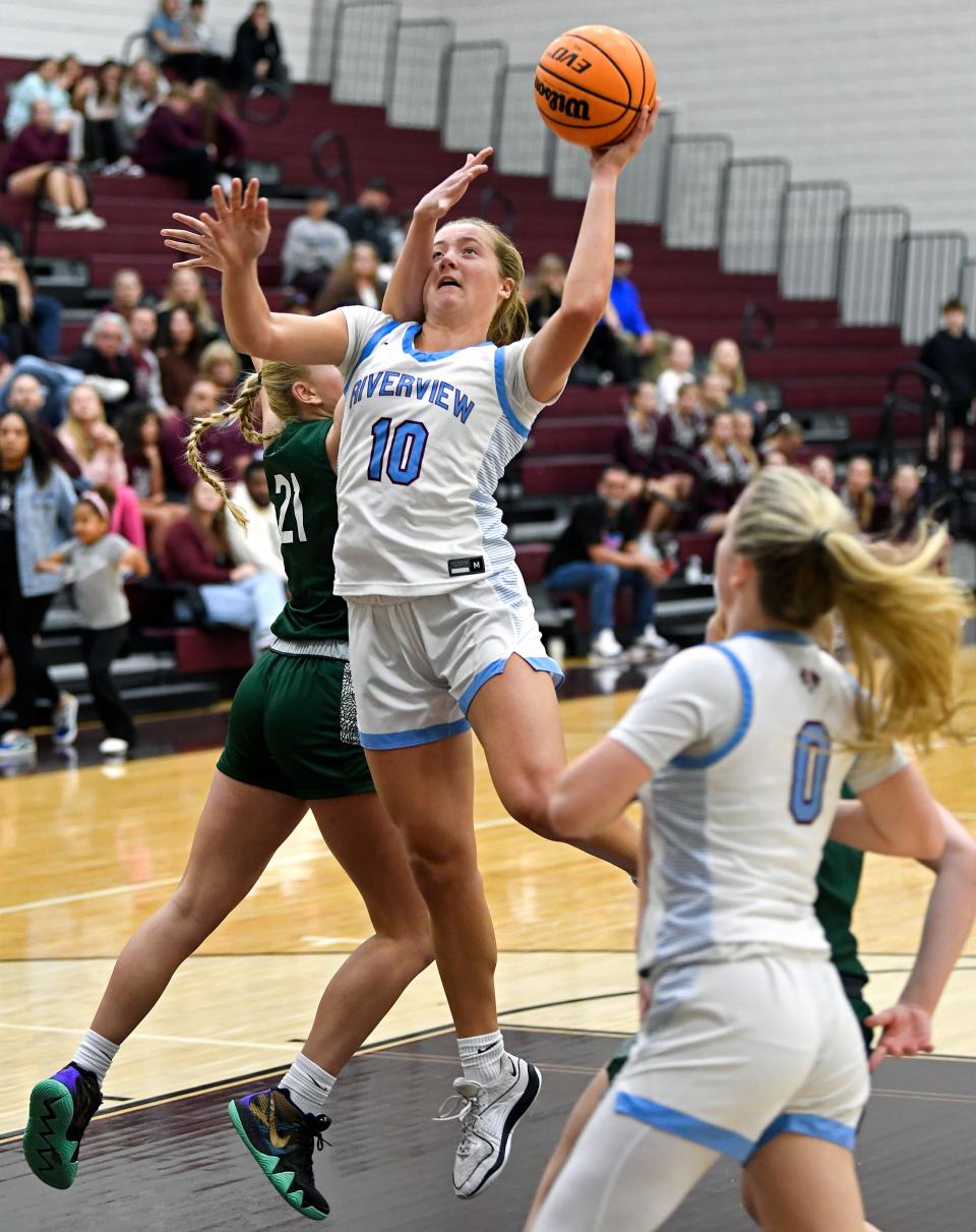 Riverview's Susan Lowther (#10) is fouled by Venice's Taylor Orris (#21) hits the basket for two points against Riverview.