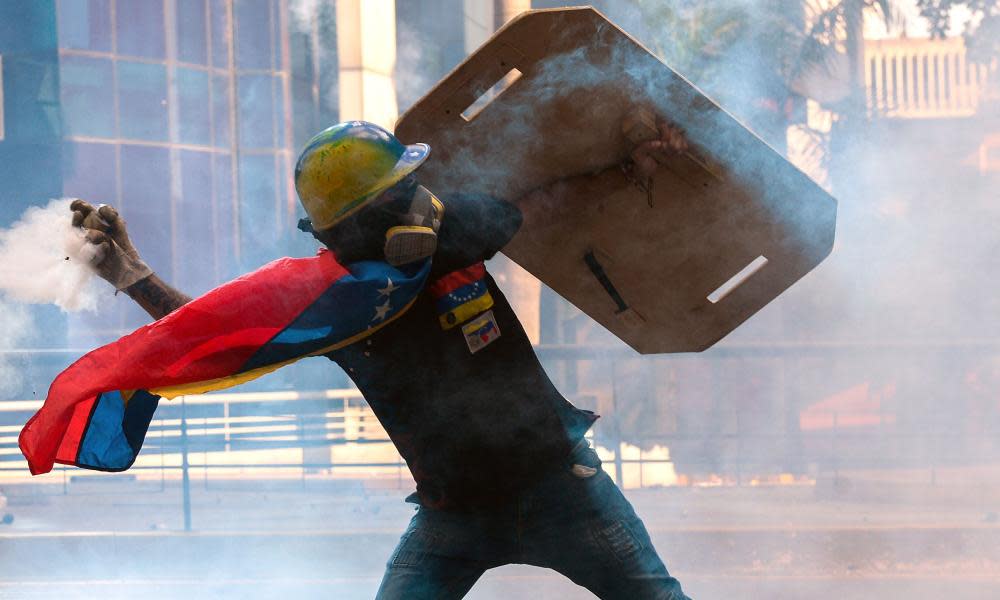 A protester battles riot police in Caracas, Venezuela, May 2017