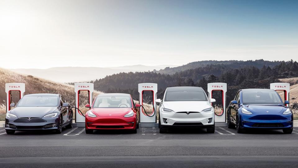 A group of Teslas at a charging station