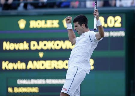 Novak Djokovic of Serbia celebrates after winning the second set during his match against Kevin Anderson of South Africa at the Wimbledon Tennis Championships in London, July 6, 2015. REUTERS/Suzanne Plunkett