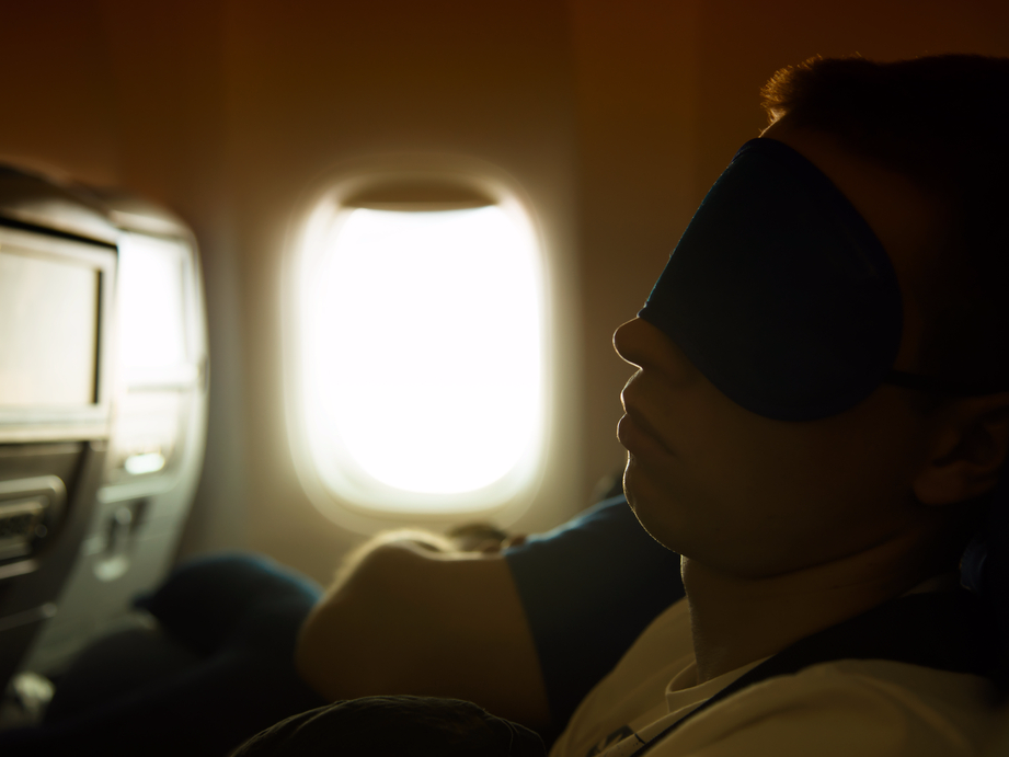 Passenger sleeping on plane