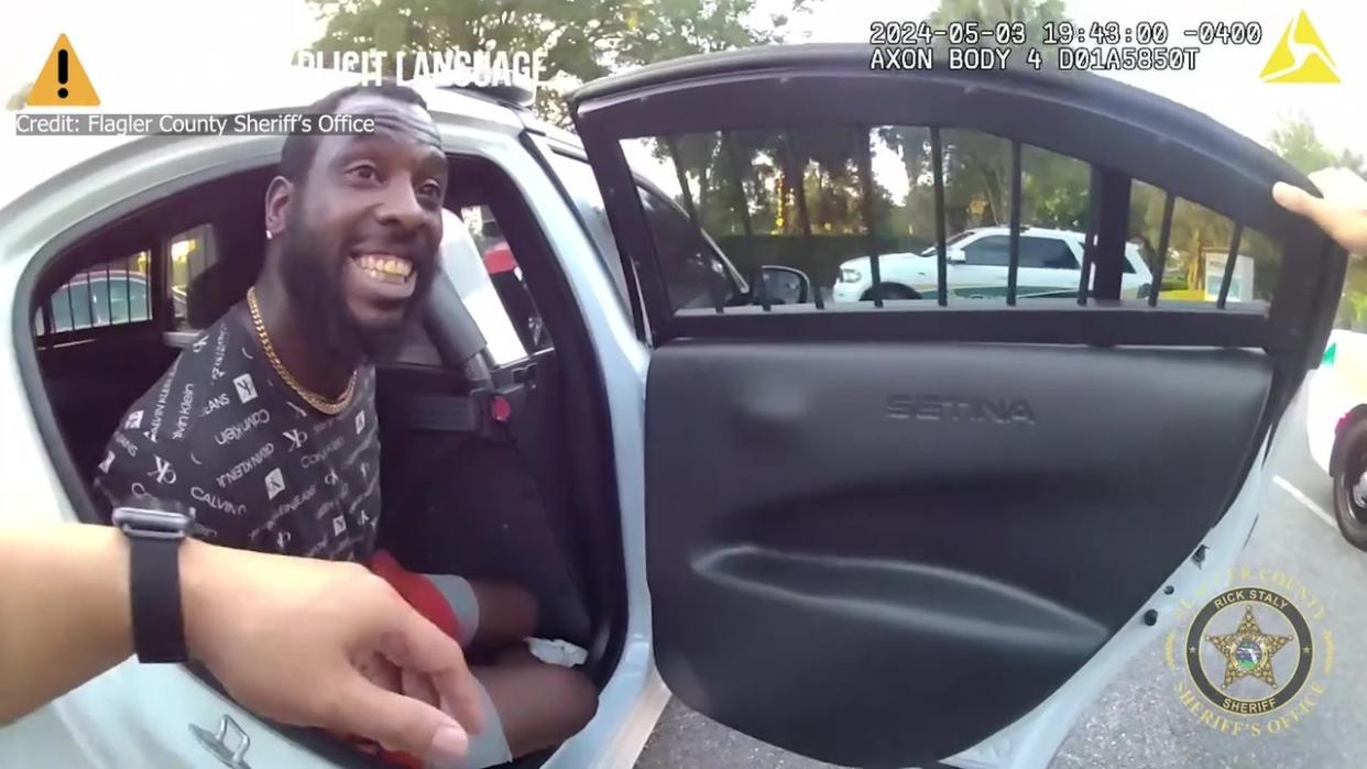 <div>While being taken to jail, Cooks is seen on camera yelling profanity and racial slurs at a deputy. Courtesy: Flagler County Sheriff's Office</div>