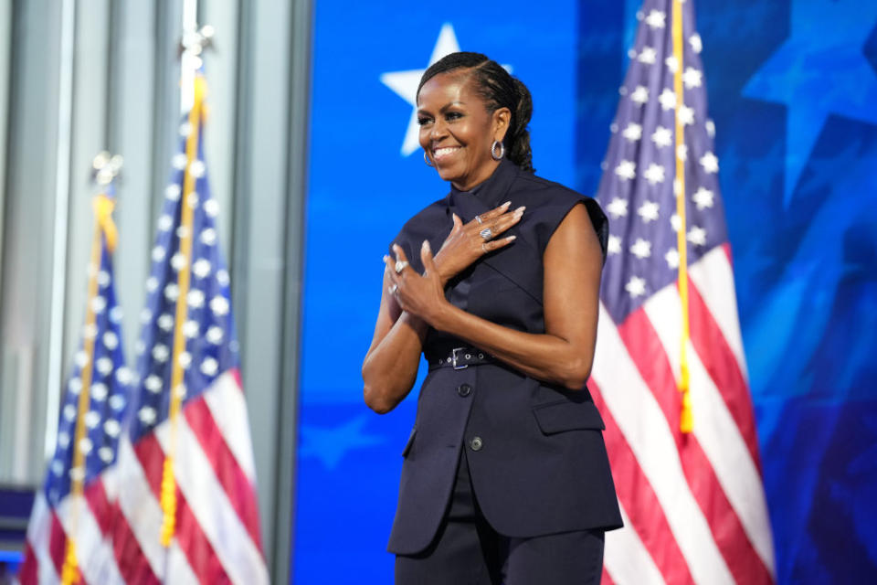 CHICAGO, ILLINOIS - AUGUST 20: Former First Lady Michelle Obama arrives on stage to speak during the second day of the 2024 Democratic National Convention at the United Center in Chicago, Illinois on August 20, 2024. Delegates, politicians and Democratic Party supporters gather in Chicago as current Vice President Kamala Harris is announced as her party's presidential nominee. The DNC will take place August 19-22. (Photo by Andrew Harnik/Getty Images)