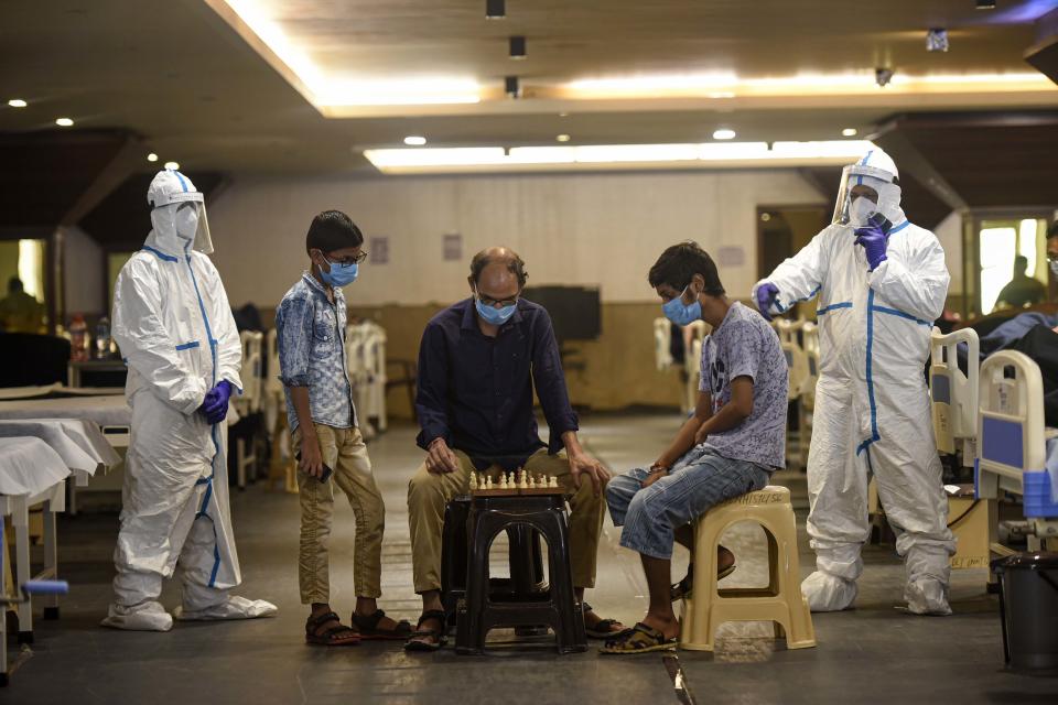 Covid-19 infected patients seen playing chess inside the Shehnai Banquet Hall quarantine centre attached to LNJP Hospital  on July 8, 2020 in New Delhi, India.  (Photo by Biplov Bhuyan/Hindustan Times via Getty Images)