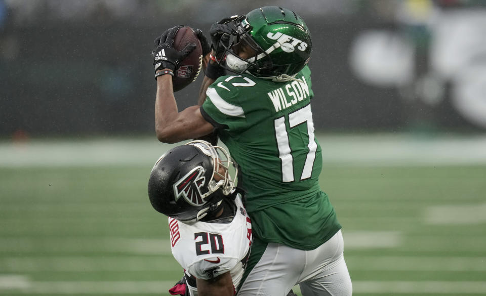 New York Jets wide receiver Garrett Wilson (17) catches a pass against Atlanta Falcons cornerback Dee Alford (20) during the third quarter of an NFL football game, Sunday, Dec. 3, 2023, in East Rutherford, N.J. (AP Photo/Seth Wenig)