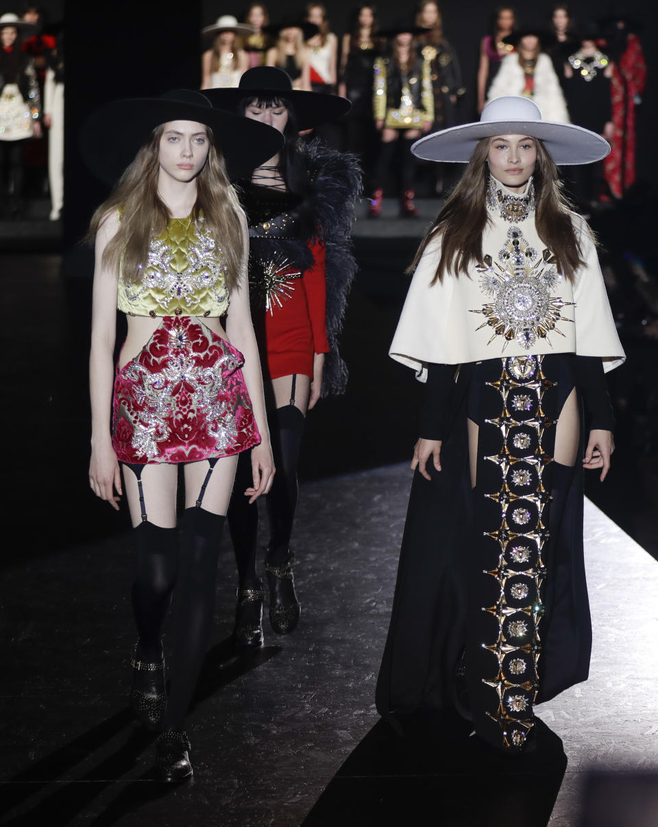 Models wear creations part of the Fausto Puglisi women's Fall-Winter 2017-18 collection, that was presented in Milan, Italy, Wednesday, Feb. 22, 2017. (AP Photo/Luca Bruno).