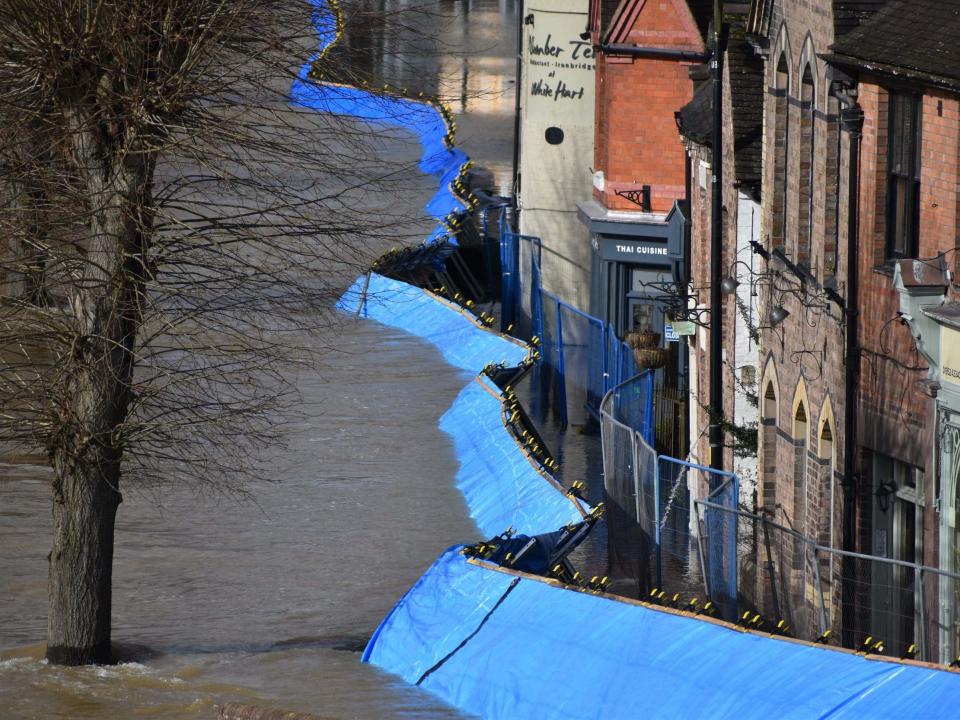 Temporary flood barriers which have been moved by the River Severn towards the Wharfage in Ironbridge, Shropshire, 26 February 2020: PA