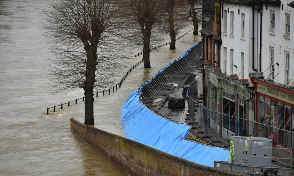 Temporary flood barriers hold back the River Severn in Ironbridge, Shropshire.