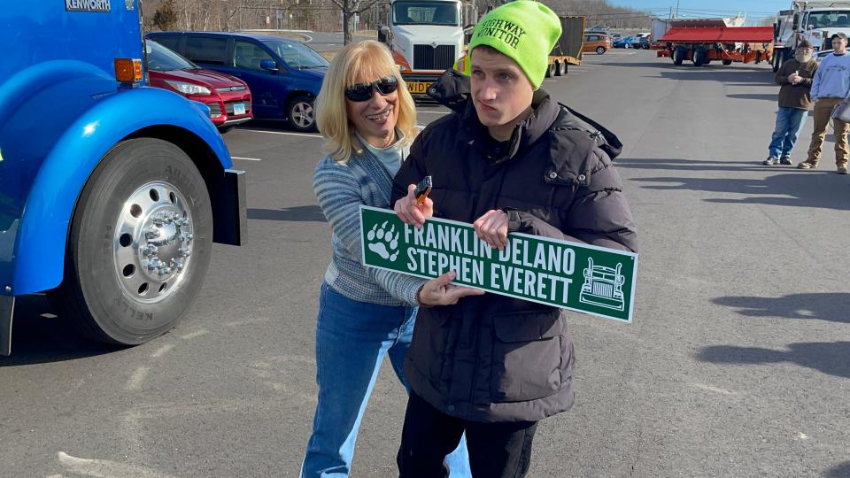 Griswold resident Franklin Delano Stephen Everett (right) and his caretaker Melissa Whipple after the lot they are in was renamed in Everett's honor. He's known for being at the lot on Fridays and waving at truckers passing by.