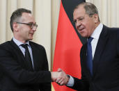 Russian Foreign Minister Sergey Lavrov, right, and Germany's Foreign Minister Heiko Maas shake hands after their talks in Moscow, Russia, Friday, Jan. 18, 2019. Germany's foreign minister has urged Russia to save a key arms treaty with the U.S. to prevent a new arms race. (AP Photo)