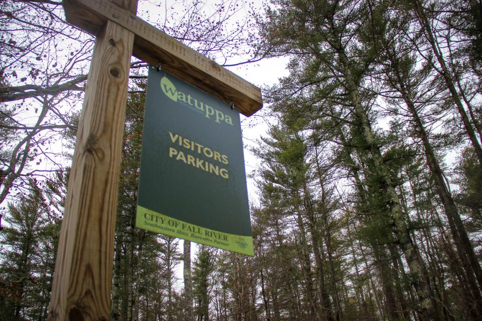 A sign leads hikers to the parking lot in the Southeastern Massachusetts Bioreserve on Blossom Road.