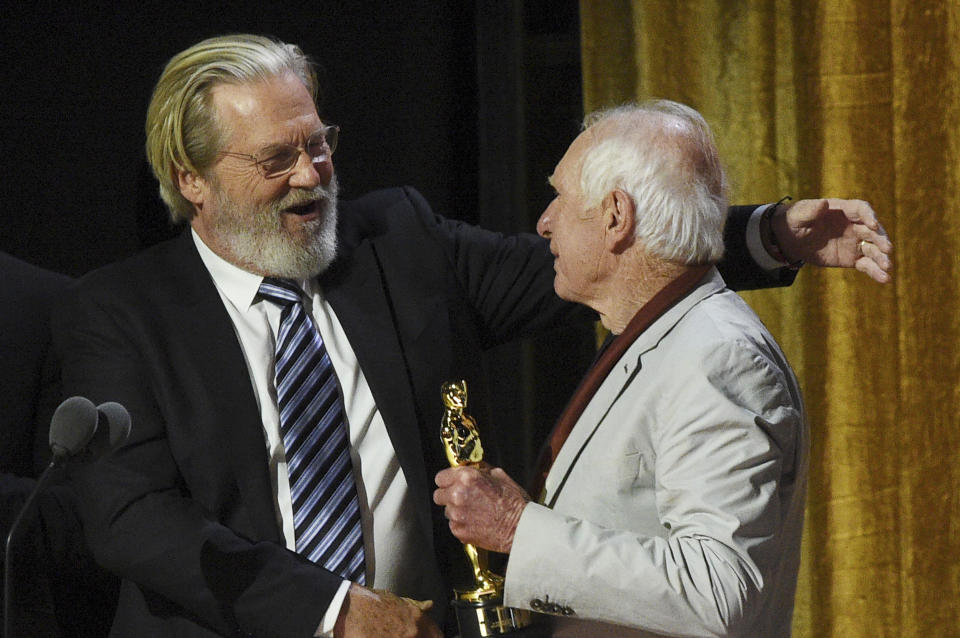 Jeff Bridges, left, and Peter Weir appear on stage during the Governors Awards on Saturday, Nov. 19, 2022, at Fairmont Century Plaza in Los Angeles. (Photo by Richard Shotwell/Invision/AP)