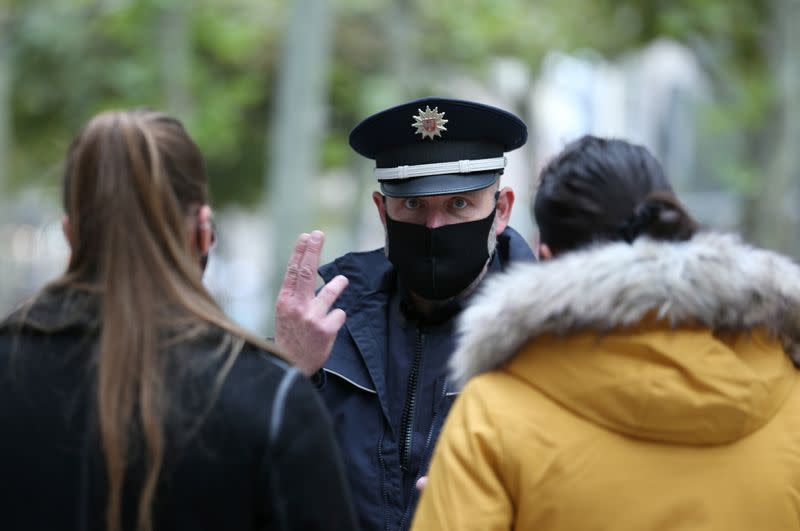 Officers of Frankfurt city police control pedestrians due to restrictions as the coronavirus disease (COVID-19) outbreak continues in Frankfurt