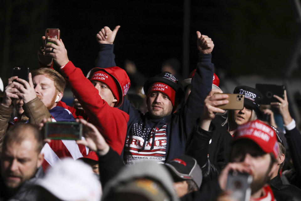 Supporters listen as the U.S. president speaks during a rally in support of Republican incumbent senators in Dalton, Georgia on January 4, 2021. (Photo by SANDY HUFFAKER/AFP via Getty Images)