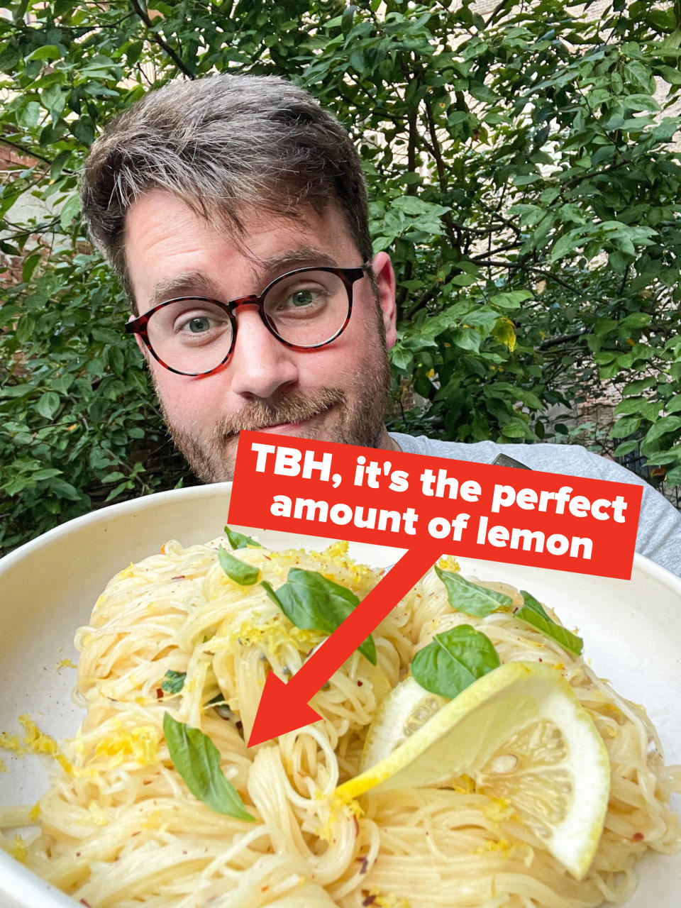 The writer with a bowl of the angel hair pasta, with caption "TBH, it's the perfect amount of lemon" and arrow pointing to the pasta