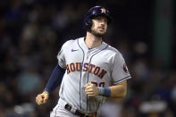 Houston Astros' Kyle Tucker watches his grand slam during the fourth inning of the team's baseball game against the Boston Red Sox at Fenway Park, Tuesday, May 17, 2022, in Boston. (AP Photo/Charles Krupa)