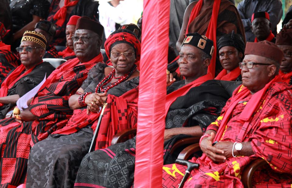 Traditional chiefs from Dzelukope, hometown of celebrated Ghanaian poet, professor, and ambassador Kofi Awoonor, await the arrival of Awoonor's coffin from Kenya, at the airport in Accra, Ghana, Wednesday, Sept. 25, 2013. Mourners sang funeral dirges and traditional leaders poured libations Wednesday for the beloved literary icon, as hundreds gathered at the airport where his body was brought home days after he was slain in the Kenya mall terror attack. Awoonor had been in Kenya with his son to take part in a literary festival, when he was among the more than 60 civilians killed at the Nairobi mall. (AP Photo/Christian Thompson)