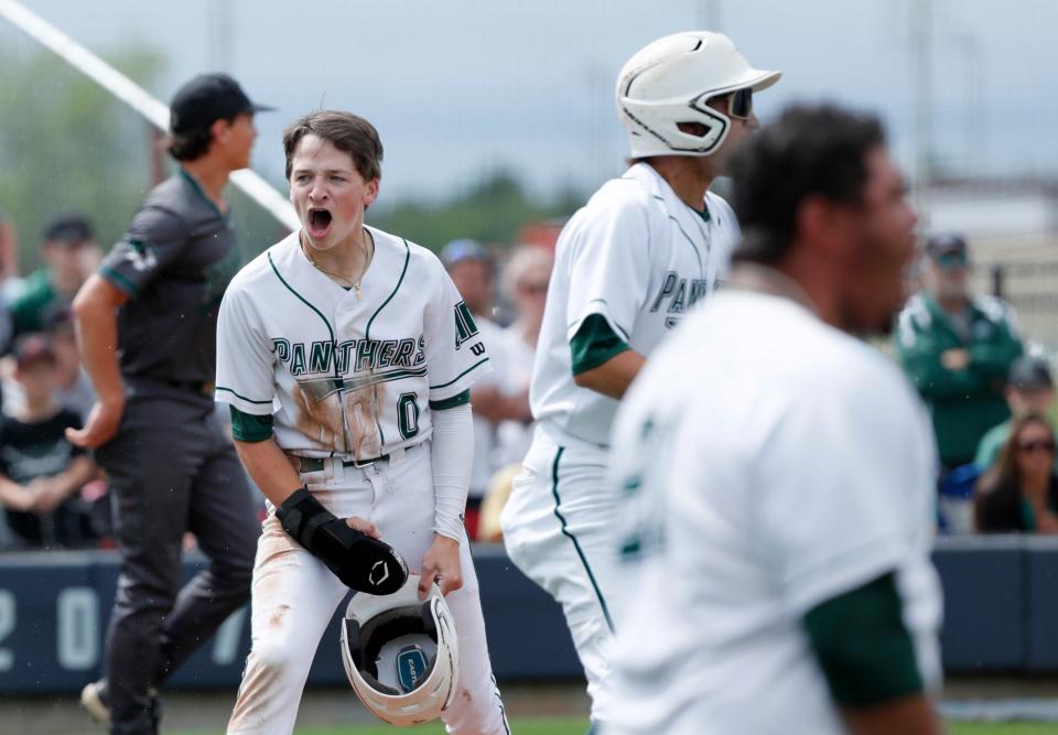Amber-Pocasset's Bennett Posey celebrates a score during the Class A state baseball championship game between Amber-Pocasset and Tushka at Shawnee High School in Shawnee, Okla., Saturday, May, 4, 2024.