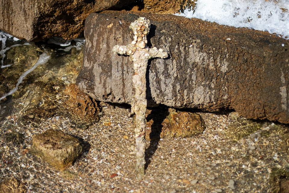 Meter-long (yard-long) sword, that experts say dates back to the Crusaders is on display in the Mediterranean seaport of Cesarea, Israel