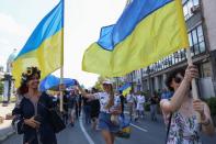 People take part in a march of solidarity to mark Ukraine Independence Day in Belgrade