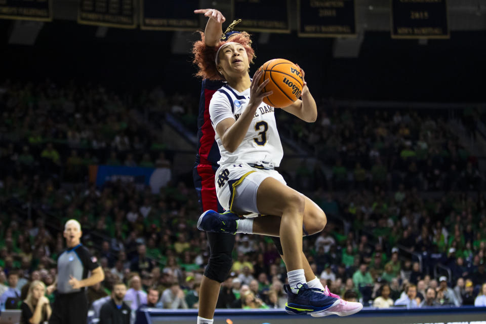 Notre Dame guard Hannah Hidalgo (3) drives past Mississippi guard Kennedy Todd-Williams, back, during the second half of a second-round college basketball game in the NCAA Tournament, Monday, March 25, 2024, in South Bend, Ind. (AP Photo/Michael Caterina)