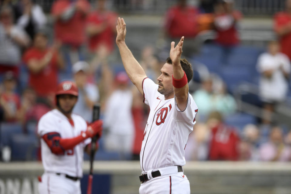 Washington Nationals' Ryan Zimmerman takes a curtain call after he was recognized as the new all-time franchise leader in runs scored during the sixth inning of a baseball game against the Baltimore Orioles, Saturday, May 22, 2021, in Washington. (AP Photo/Nick Wass)