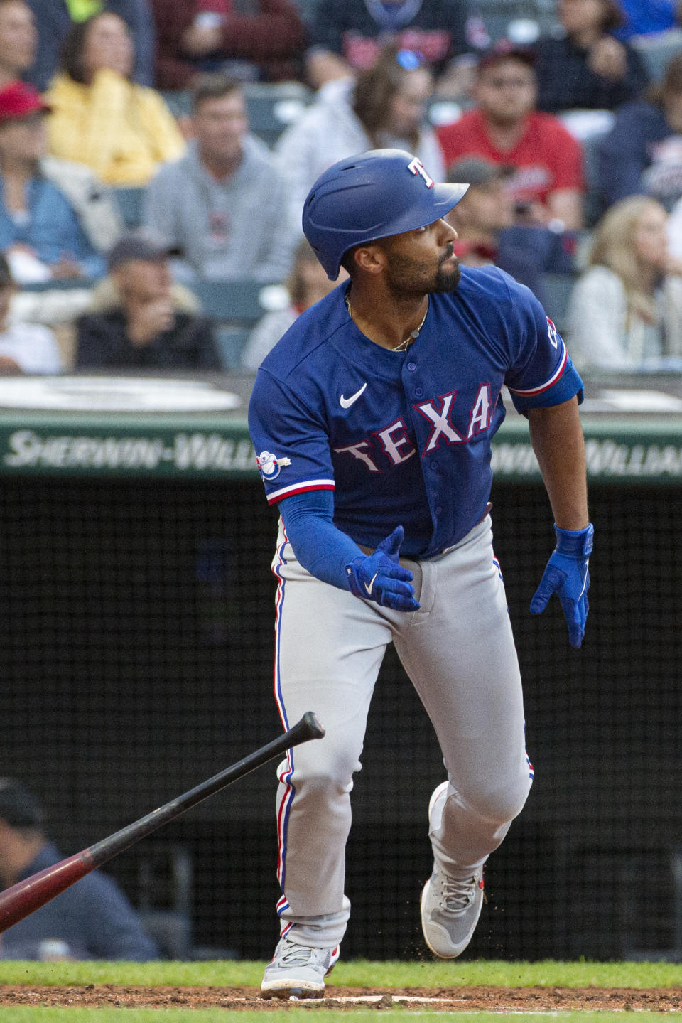 Texas Rangers' Marcus Semien watches his solo home run off Cleveland Guardians starting pitcher Kirk McCarty during the third inning of the second game of a baseball doubleheader in Cleveland, Tuesday, June 7, 2022. (AP Photo/Phil Long)