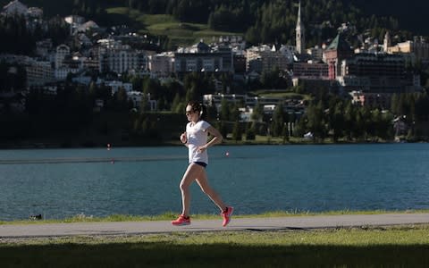 Laura Muir of Great Britain runs beside lake in St Moritz, Switzerland - Credit: GETTY IMAGES